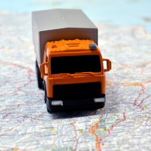 concept small white toy car on italy map concept small white toy car on italy map